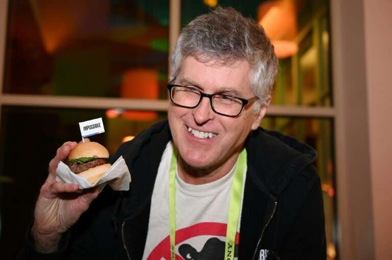 Impossible Foods CEO Pat Brown—holding up the Impossible Burger 2.0 at a press event in Las Vegas, Nevada on January 7, 2019—fou