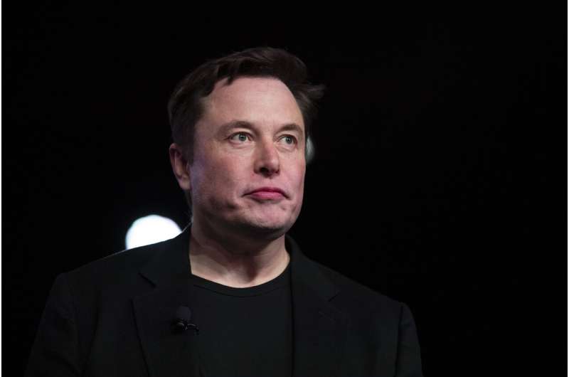 Tesla CEO lifts shareholder spirits, takes aim at media
