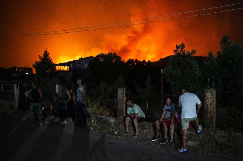 The fire that broke out on Greece's second-largest island on Tuesday caused the evacuation of several villages
