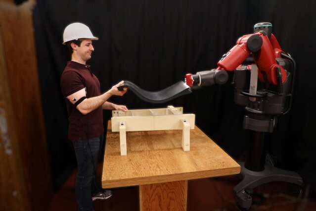 This robot helps you lift objects — by looking at your biceps