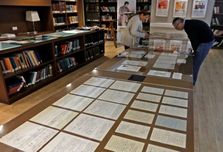 Visitors look at some of Albert Einstein's manuscripts on display in the Jerusalem's Hebrew University of Jerusalem
