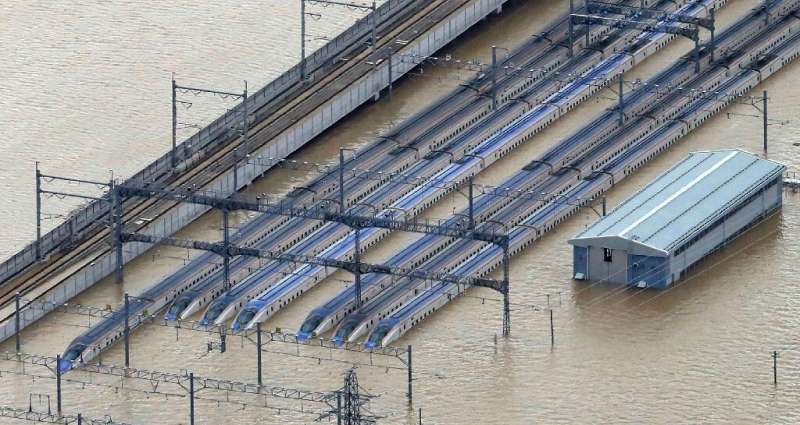 An aerial view of the flooded shinkansen bullet train depot in Nagano, where 10 trains were reportedly damaged by the typhoon wh