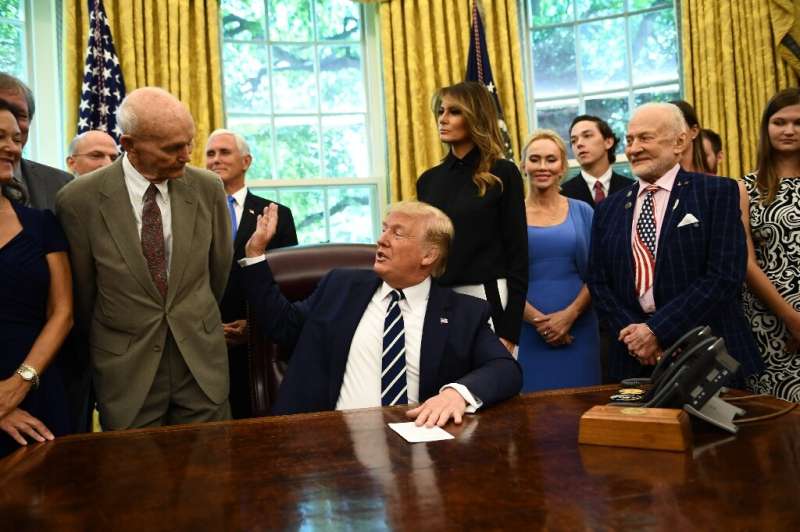 US President Donald Trump and First Lady Melania Trump host Apollo 11 crew members Michael Collins (L), Buzz Aldrin (R) and thei