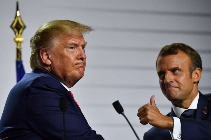 US President Donald Trump (L) and French President Emmanuel Macron unveiled an agreement allowing France's digital tax to remain