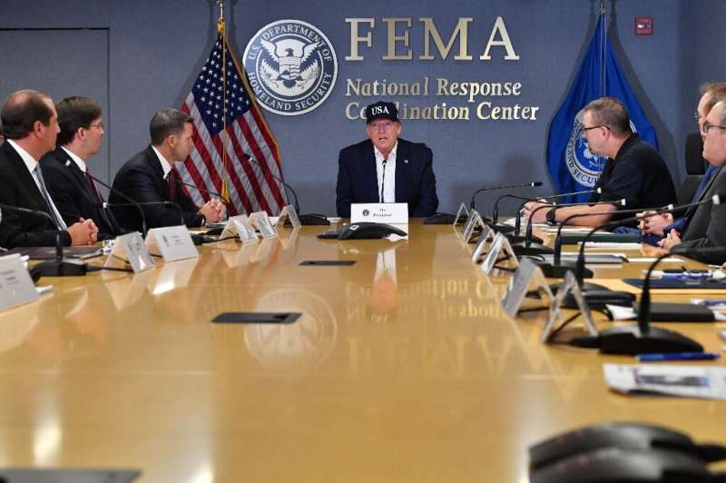 US President Donald Trump receives a briefing at the Federal Emergency Management Administration (FEMA) on Hurricane Dorian in W