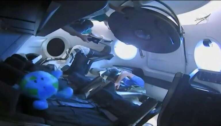 A dummy named Ripley rides inside the SpaceX Dragon capsule on a mission that sets the stage for the resumption of manned space 
