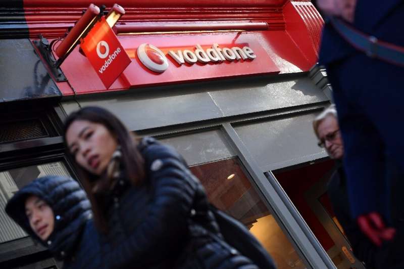 Europe's biggest mobile phone company Vodafone has slashed its shareholder divided after posting a steep annual net loss