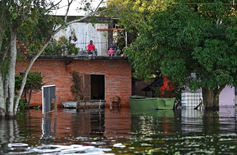 Some residents living close to the Paraguay River have had to move into the upper floors of their homes to escape the rising flo