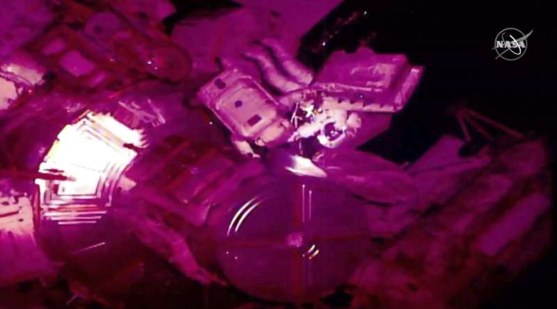 Spacewalking astronauts add new pumps to cosmic detector