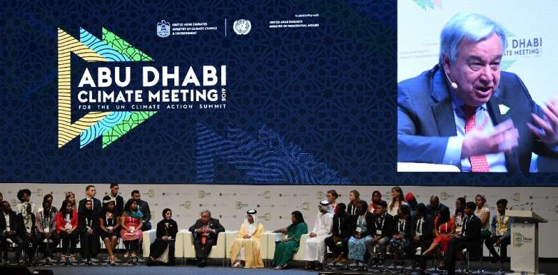 UN Secretary General Antonio Guterres (C) and Emirati ministers chair a panel at the Abu Dhabi climate meeting in Abu Dhabi