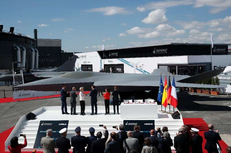 French President Emmanuel Macron, third from right, joined other officials in front of a full-scale model of new jet for Europe'