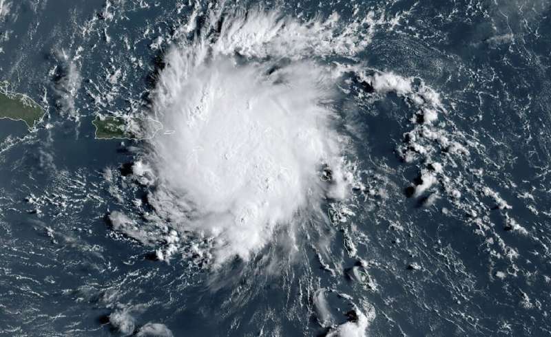 This satellite image obtained from NOAA/RAMMB, shows Tropical Storm Dorian as it approaches Puerto Rico in the Caribbean at 11:4