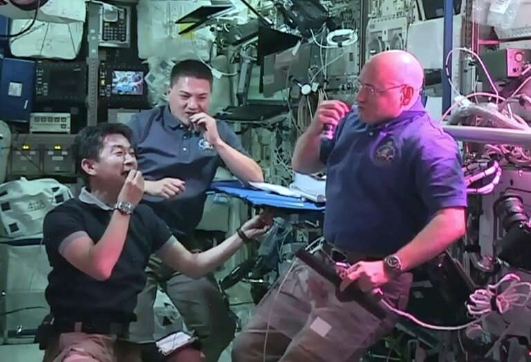 US astronaut Scott Kelly (R) aboard the International Space Station