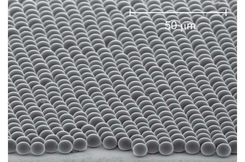 Self-assembled microspheres of silica to cool surfaces without energy consumption