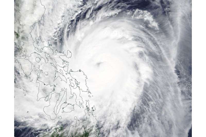 Satellite imagery shows Typhoon Kammuri's center obscured
