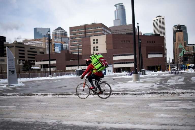 A bicyclist braves the cold in downtown Minneapolis, Minnesota