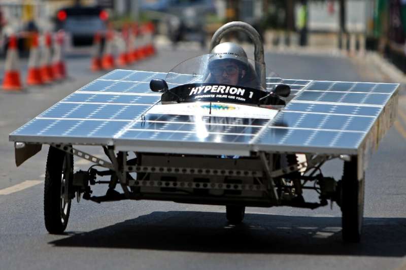 A Cypriot competitor steers his solar car during the Cyprus Institute's solar car challenge in Nicosia on June 23, 2019