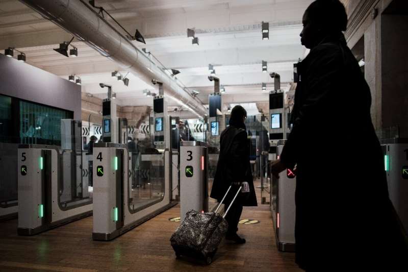 A Eurostar passenger going through an automated ePassport gate equiped with a facial recognition system the gare du Nord in Pari