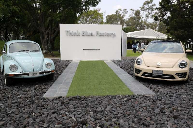 A final edition (right) of the Volkswagen &quot;Beetle&quot; is seen next to a last edition of a previous model of the iconic ca