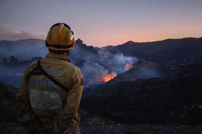 A fire raging on Gran Canaria has subsided after officials said they feared an 'environmental tragedy'