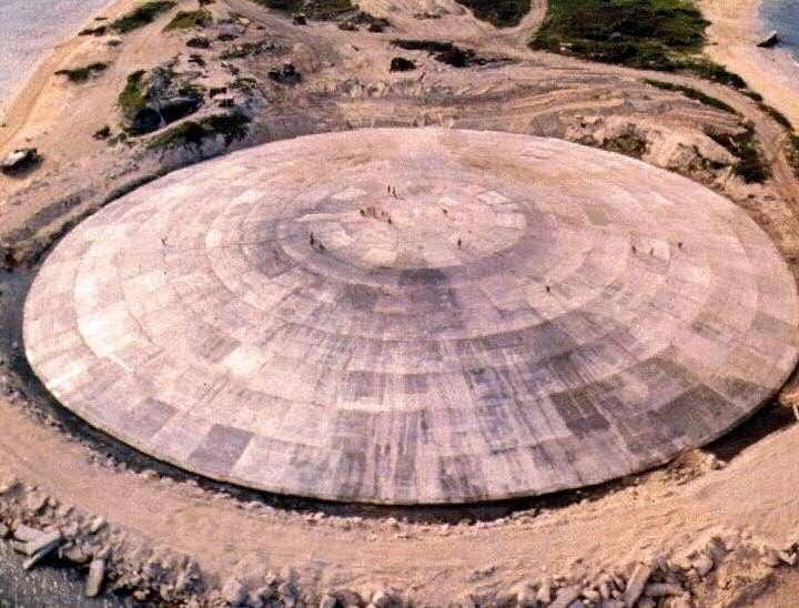 A huge concrete dome built over a crater left by one of the 43 nuclear blasts on Runit Island photographed in 1980