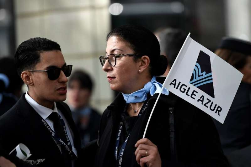 Aigle Azur employees rallied outside the French Transport Ministry in Paris on Monday, urging the government to help safeguard t