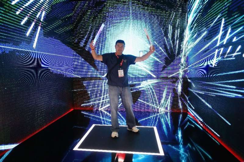 A man plays &quot;Beat Saber&quot; during the E3 Video Game Convention in Los Angeles in June 2019