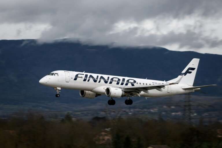 An Embraer 190 commercial plane with registration OH-LKI of Nordic carrier Finnair is seen landing at Geneva Airport on March 11