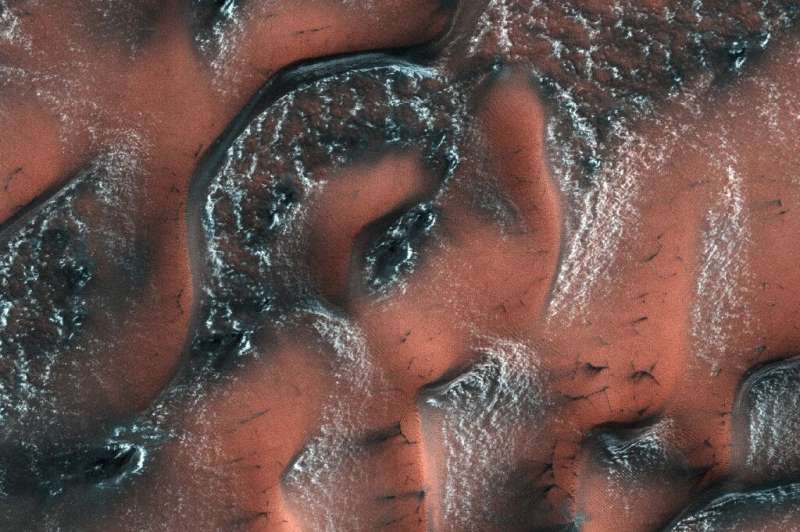 An image from NASA's Mars Reconnaissance Orbiter shows snow and ice accumulated during winter covering dunes in the planet's nor