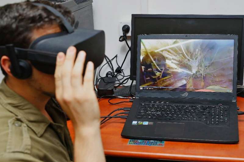 An Israeli soldier takes part in an underground combat simulation using virtual reality (VR) technology, at an army base in Peta