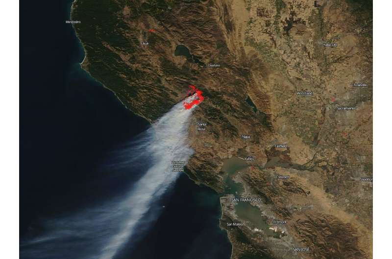 A photo from NASA's Terra satellite shows the smoke plume cascading down the coast from California's devastating Kincaid Fire in