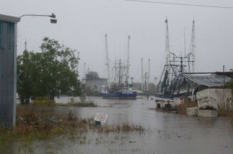 A port floods as Tropical Storm Barry makes landfall in Intracoastal City, Louisiana on July 13, 2019