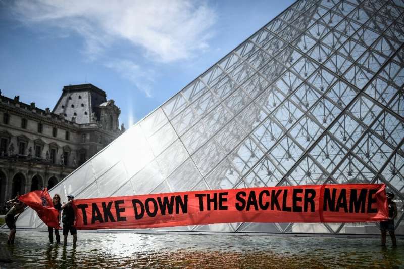 A protest outside the Louvre museum in Paris calling for it to cut ties with the Sacklers