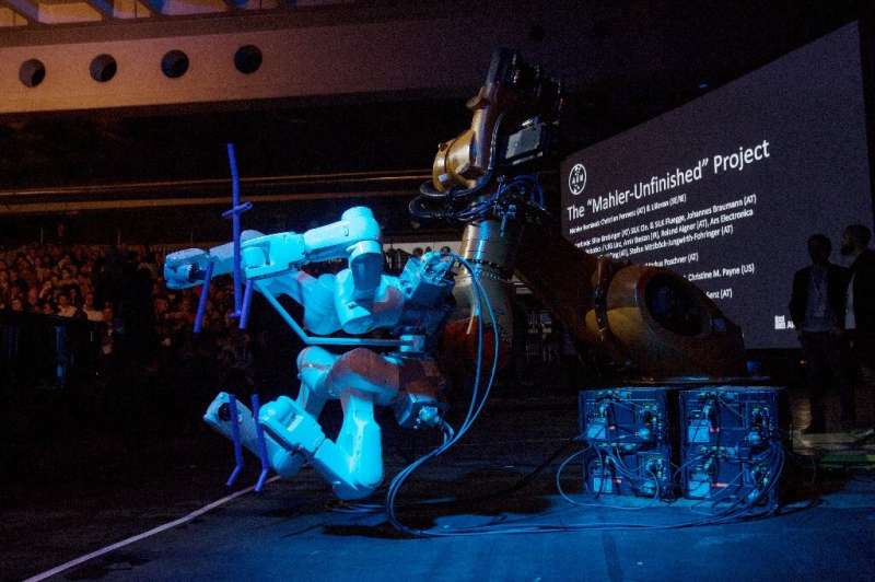 A robot stands on stage during the &quot;Mahler Unfinished Project&quot; at the Ars Electronica in Linz,  Austria