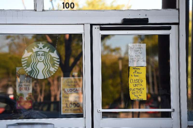 A Safeway grocery store and Starbucks Coffee are closed after the power was shut down as part of a statewide blackout in Santa R