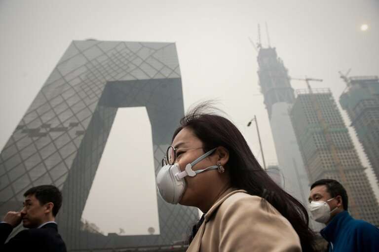 A smoggy day in Beijing. Executives with families are often unwilling to put their children's health at risk for a job.