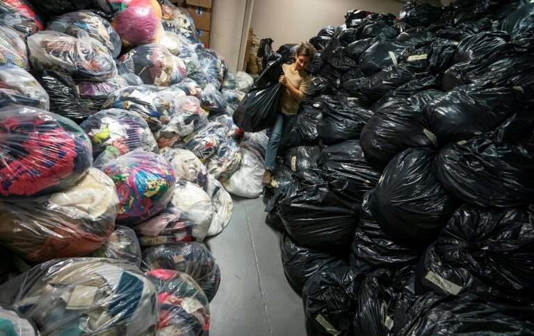 At Fabscrap's Brooklyn warehouse, employees and volunteers sort through huge bags of fabric scraps—which are then recycled, shre