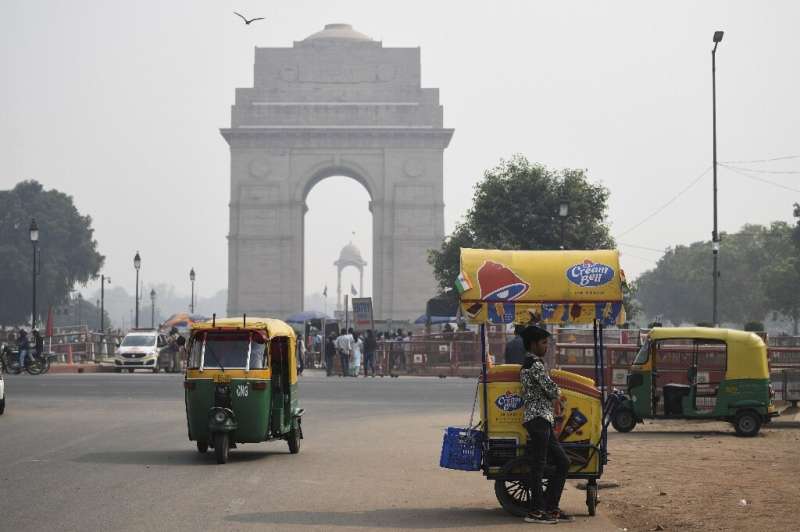 A thick smog engulfed Delhi's landmarks such as the capital's India Gate