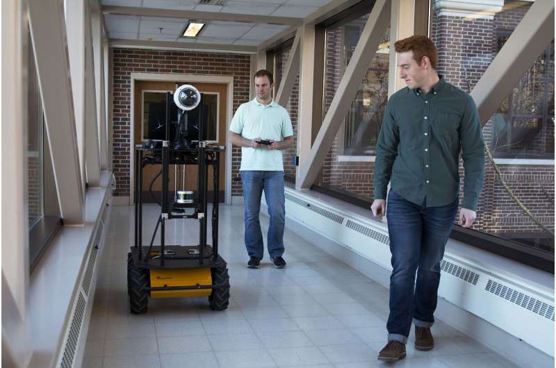 Autonomous robot that interacts with humans using natural language and vision processing