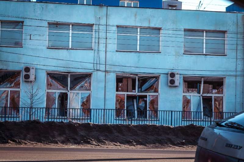 A view of the facade of a local paint and varnish plant damaged by a shockwave from a meteor in the Urals city of Chelyabinsk on