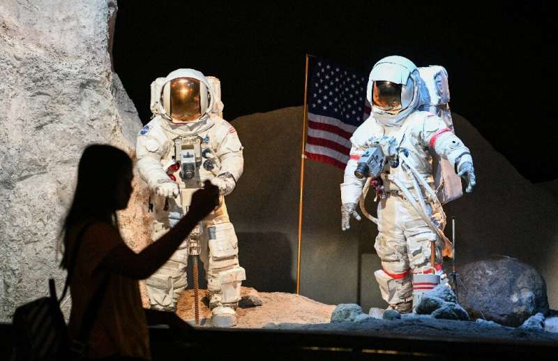 A visitor looks at a lunar landscape exhibit during the Apollo 11, 50th Live celebration at Space Center Houston in Houston, Tex