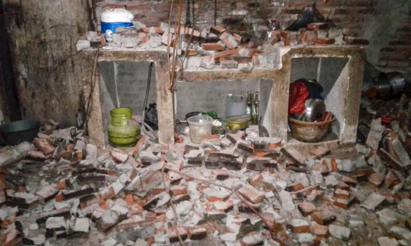 A wall of a village house collapsed after a strong earthquake hit Sukasari in Lebak, Banten province