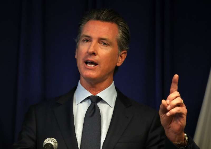 California Gov. Gavin Newsom said a law he signed requiring rideshare firms to treat drivers as employees would be a step toward