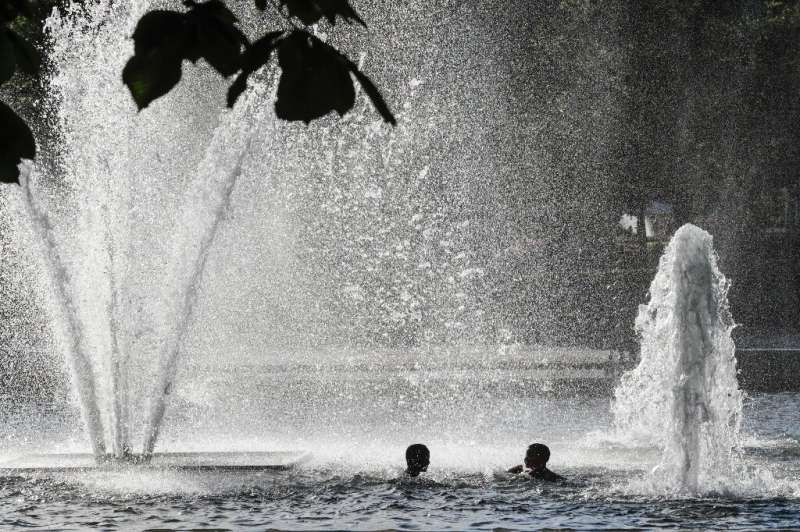 Children cool down in a  fountain in Oslo
