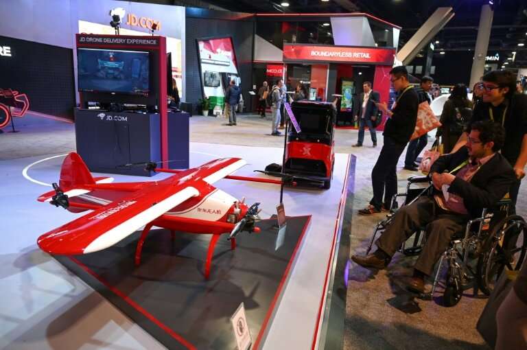 Chinese online retail and logistics company JD displays delivery robots and drones that are part of  smart retail technology bei