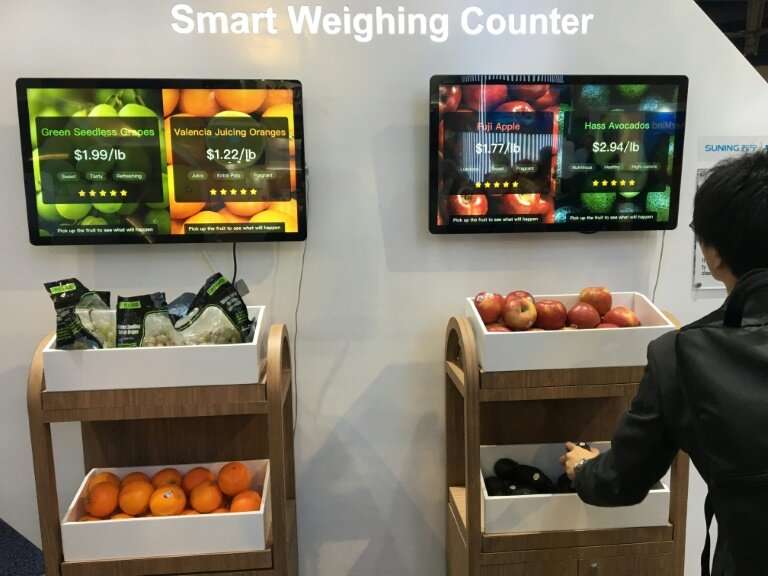 Chinese retail giant Suning's exhibit at the  Consumer Electronics Show shows a smart weighing counter that can enable consumers