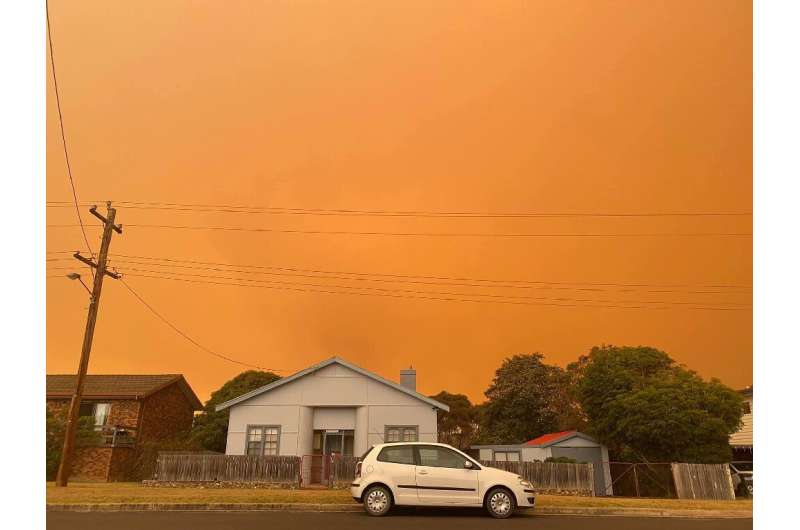 Distant bushfires light up the skies in the coastal town of Bermagui in New South Wales state