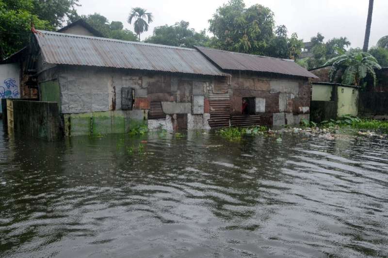 Dozens of people have died and thousands displaced by monsoon floods in India