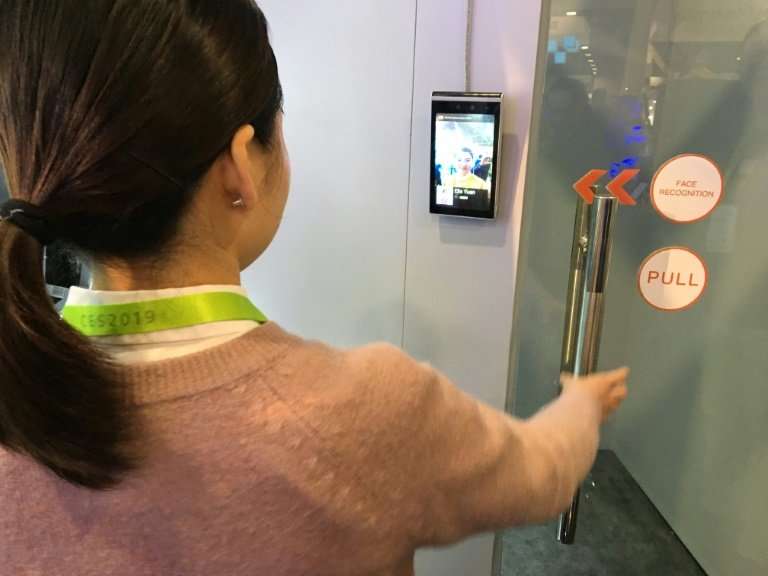 Ella Yuan of the Chinese startup Tuya shows how facial recognition can be used in a home security system to allow or deny entry,