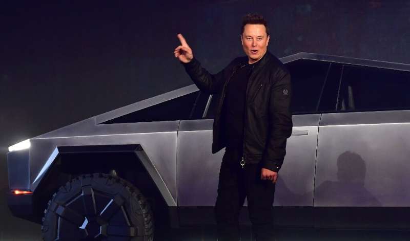 Elon Musk is seen introducing a new battery-powered Tesla truck in Hawthorne, California on November 21, 2019; his new people-mo